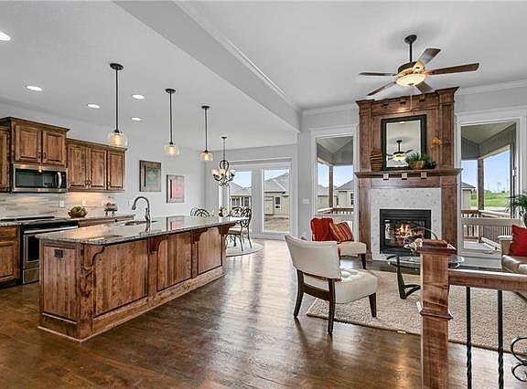 The Coventry has a beautiful open floor plan. Tall windows make this space light and bright. PHOT