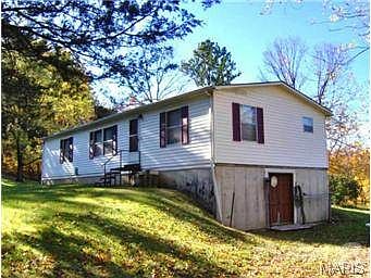 WELL-KEPT MANUFACTURED HOME ON A FULL WALK-OUT BASEMENT