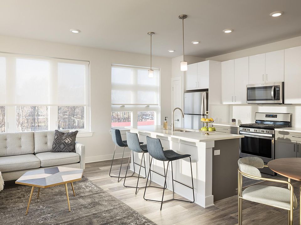 Open concept layouts with ultra-modern two-tone kitchens