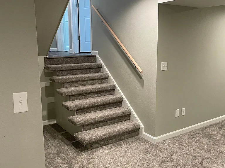 Stairs to basement/game room/extra bedroom