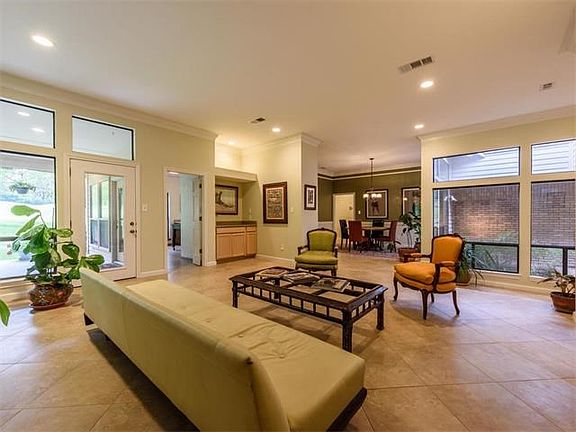 Living area open to dining, wet bar.