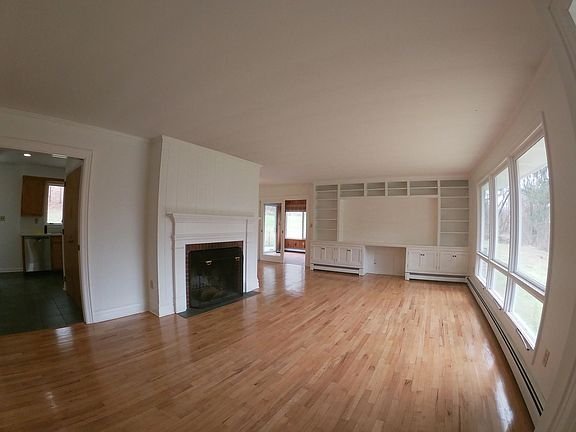 Living Room: Fireplace, Hardwood Floors and Built-in Book Shelf / TV Cabinet