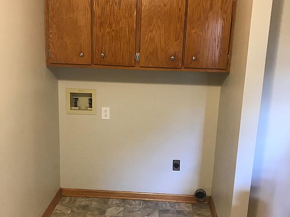 LAUNDRY HOOKUPS OFF KITCHEN AND DINING AREA.