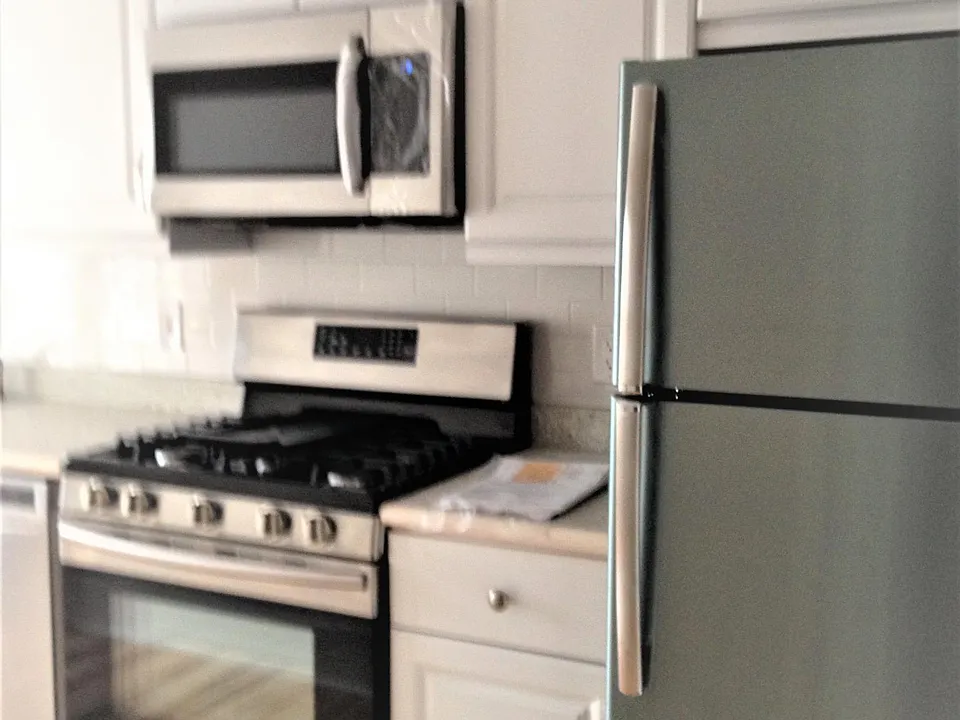 Kitchen showing refrigerator