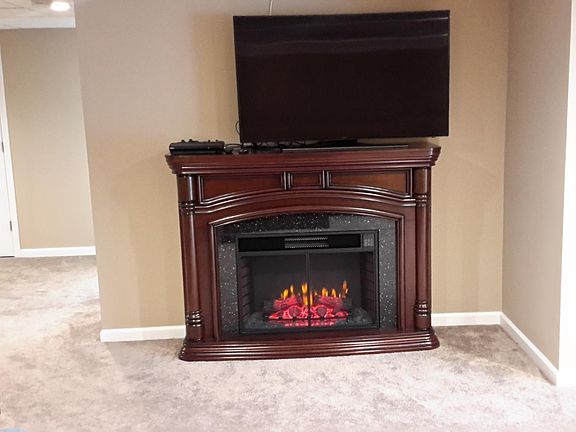 Living room fireplace and big screen t.v.