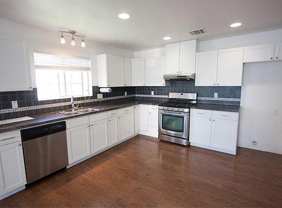 New counters with granite counter tops and stainless applian