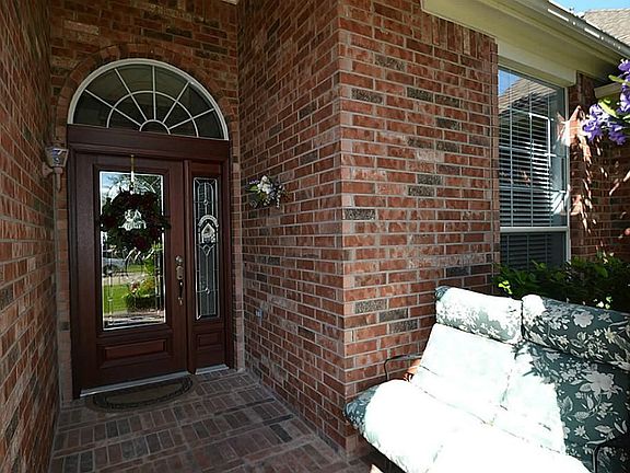 Front doorway and porch inviting you inside.