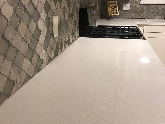 New gas stove and quartz countertops