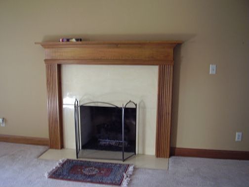 Fireplace in the family room with marble surround