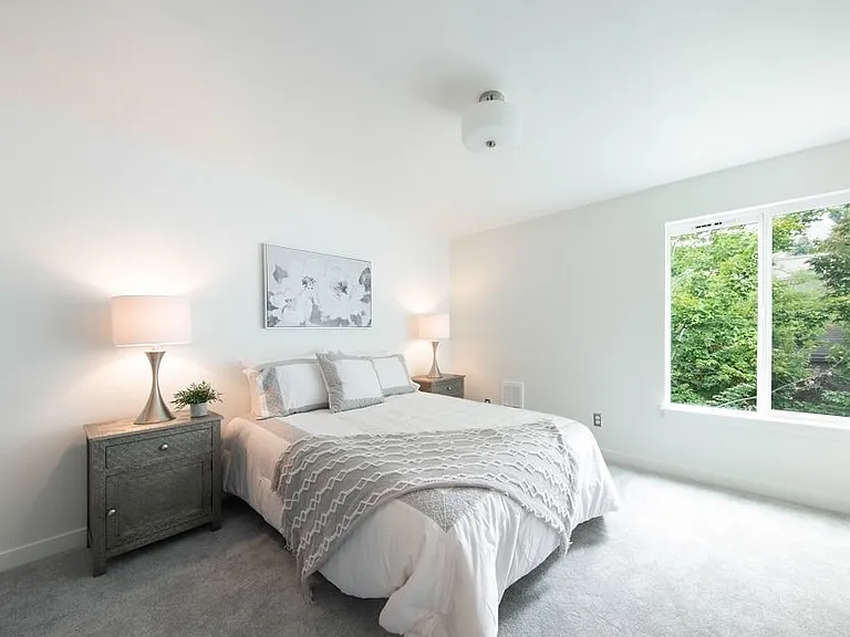 Primary bedroom- room for a king sized bed, large sliding door closet and plush fresh carpet