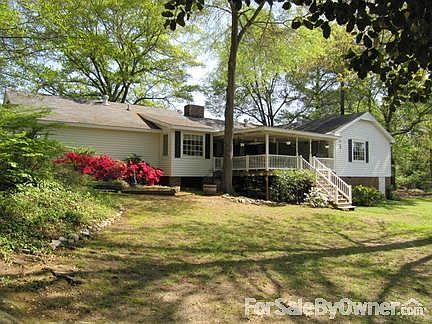 Back yard, covered deck
						:
						Landscaped back yard with covered deck ovelooking lake.