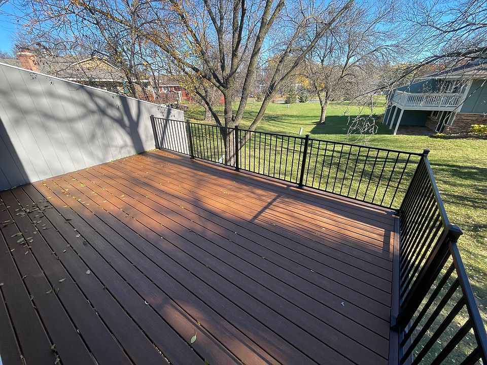 Huge 2nd Story Composite Deck overlooking large grass area. Great shade all day.