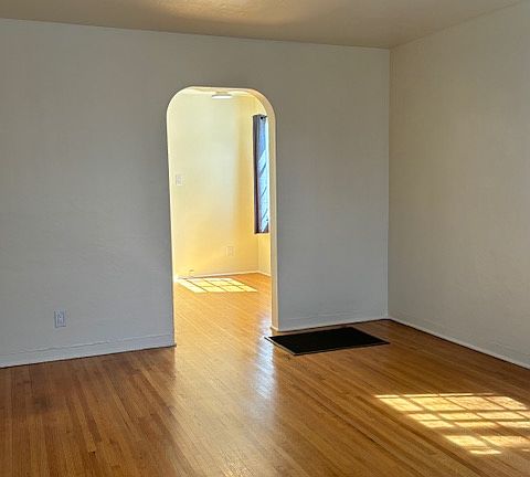 Living area looking into kitchen/dining