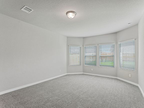 The primary bedroom of a home in Wall Street Village of Richmond, TX.
