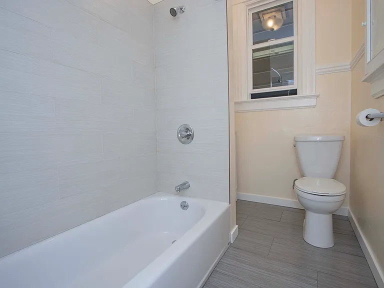 Bathroom as viewed from the hallway; vanity (see next picture) is behind the shower wall