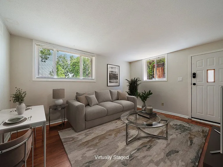 Living room with lots of East and Southern light (virtually staged)
