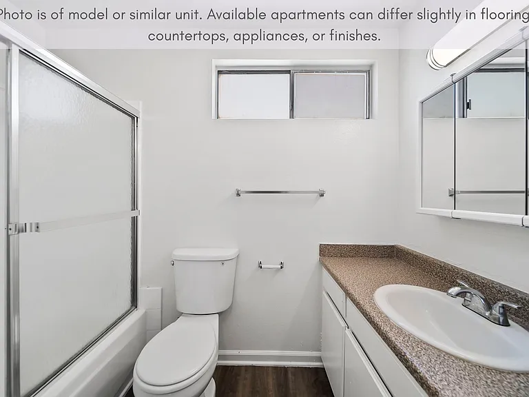Clean bathroom with a full tub/shower combo and generous counter space.