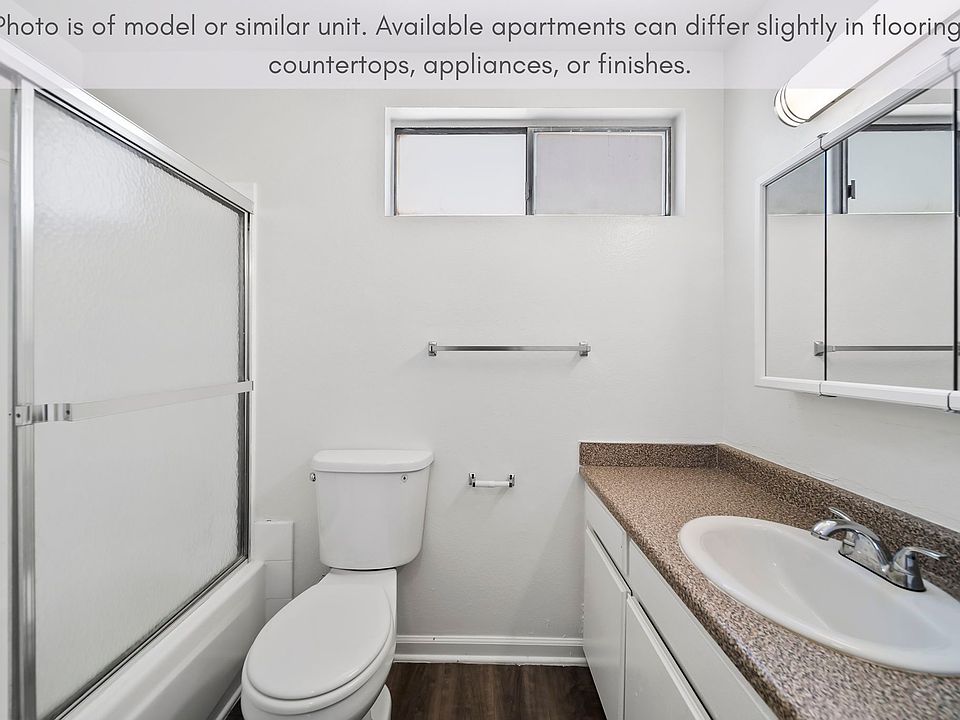 Clean bathroom with a full tub/shower combo and generous counter space.
