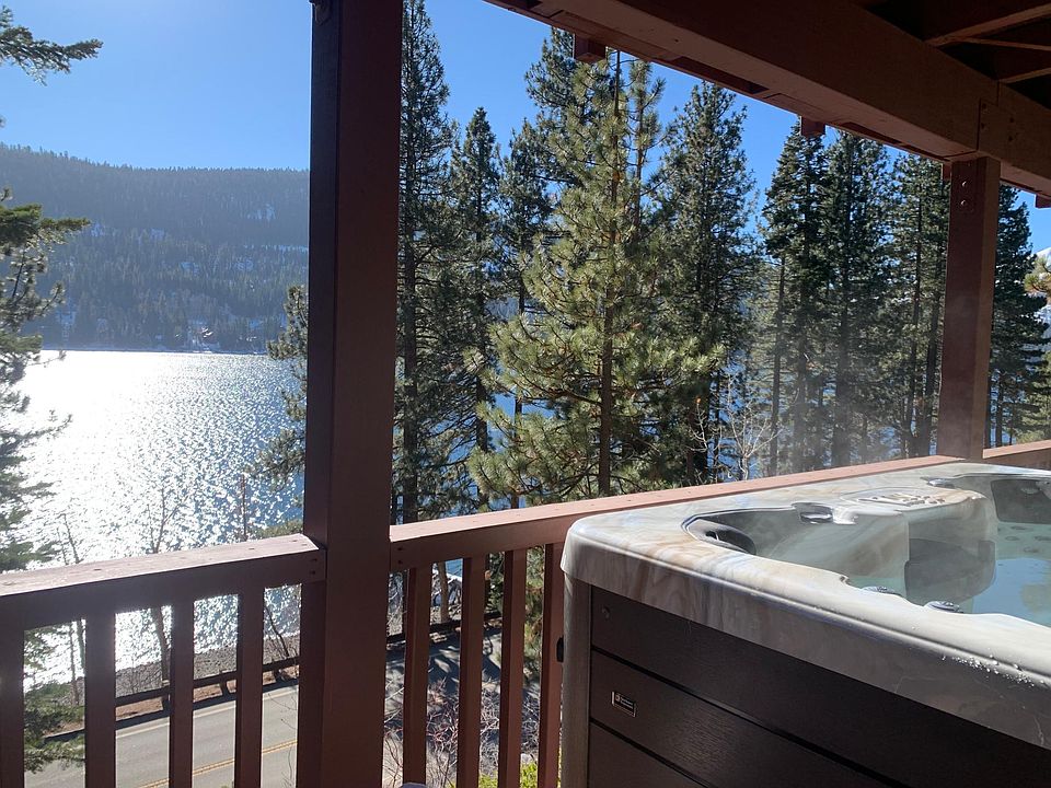 Covered hot tub on the deck with monthly hot tub cleaning