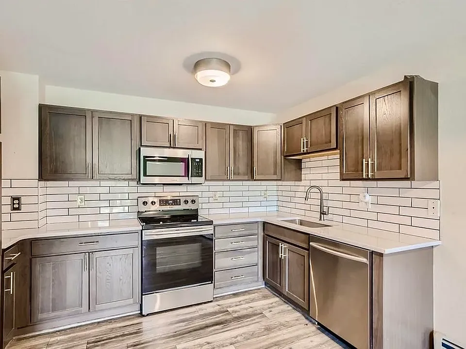 Kitchen with stainless steel appliances, quartz counters, and soft-close cabinetry