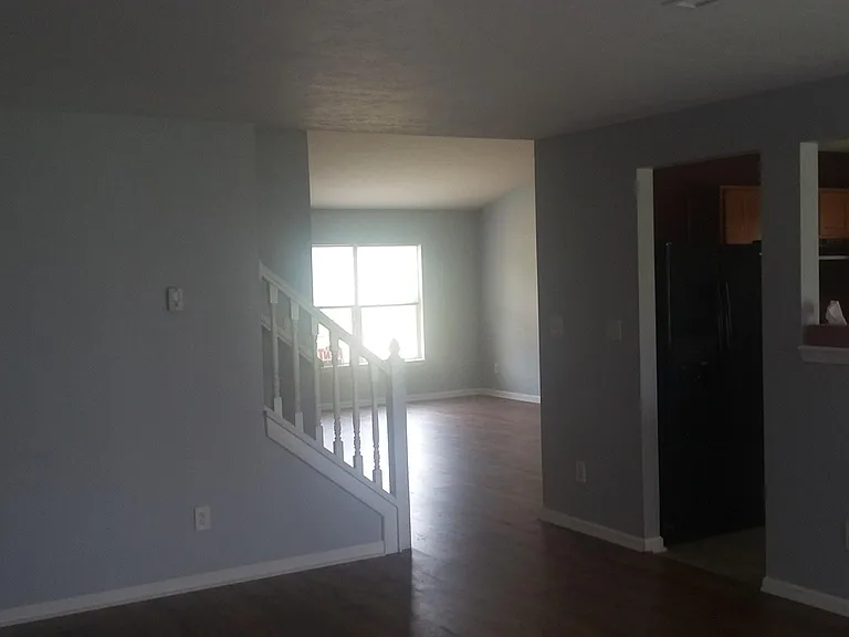 HALL WAY FROM LIVING ROOM TO FAMILY ROOM AND KITCHEN