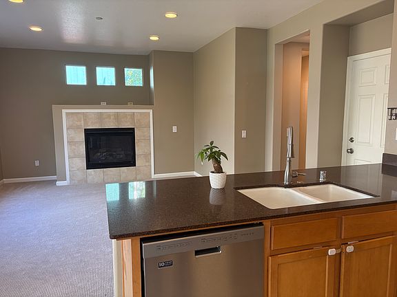 Kitchen overlooking the familyroom makes entertaining guests convenient and friendly.