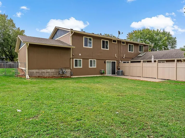 Huge fully fenced-in back yard complete with concrete patio and privacy fence