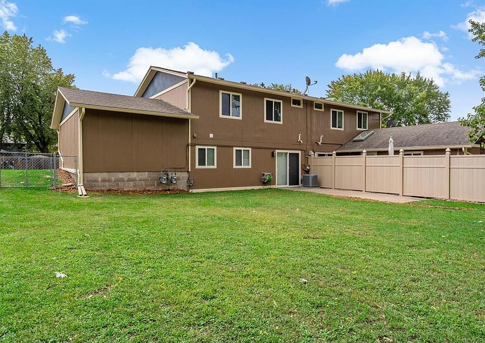 Huge fully fenced-in back yard complete with concrete patio and privacy fence