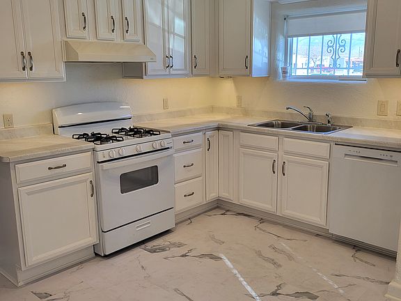 Kitchen, all new appliances, new thick vinyl flooring, 2-speed stove exhaust vents to outside.