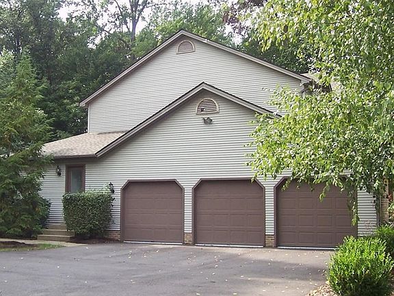 Three-car attached garage has direct access to full basement.  Door to the left of garage leads to a bright room perfect for a home office.