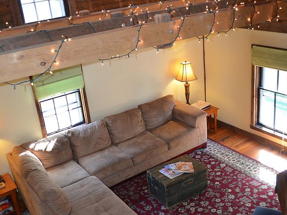 Living room with vault ceiling.