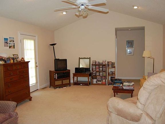 "Vaulted ceiling crowns the living room"