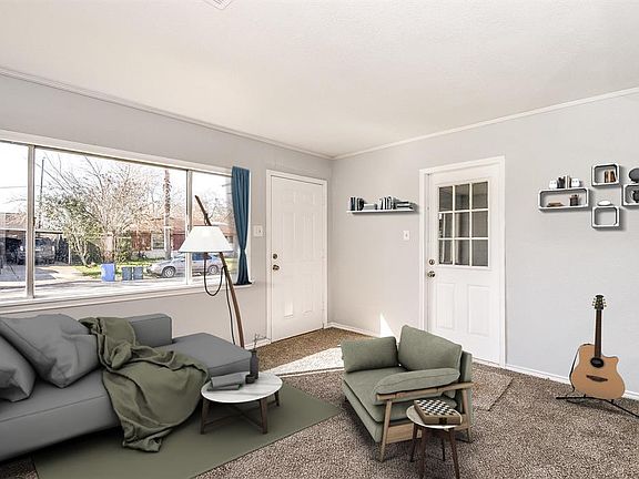 This spacious room has been virtually staged as a den; however it could be your media room, study or a fourth bedroom.