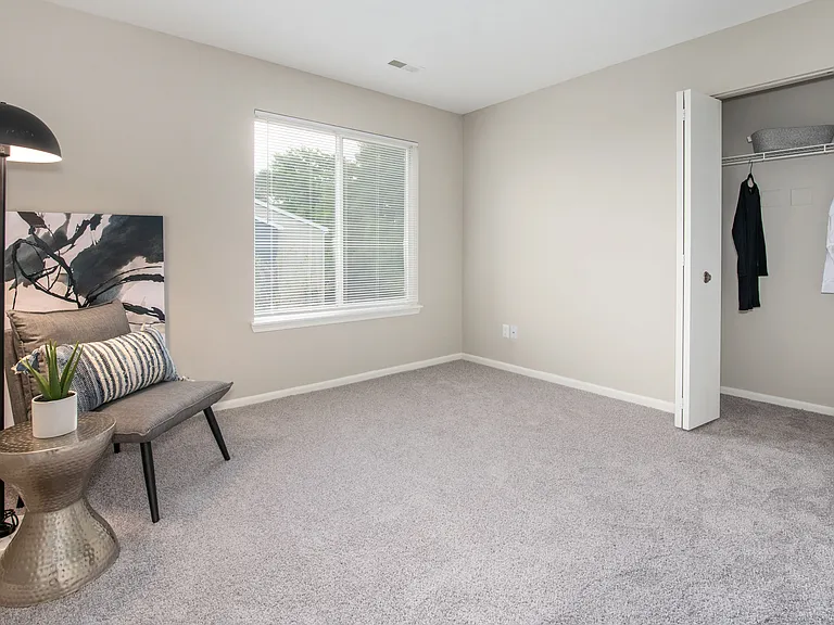 Comfortable living spaces feature plush carpeting and neutral tones for easy decorating, professionally operated by Highlands Vista Group.