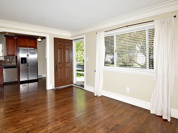 View from Living Room to Front Door and Kitchen
