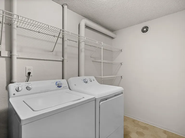 Dedicated laundry room with storage Dedicated laundry room with storage