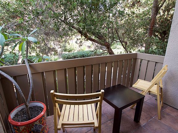 You have your own private balcony area...shaded and protected by wonderful trees.