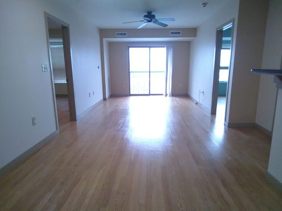 Living/Dining room open concept and a beautiful view of Boston/ Tobin bridge