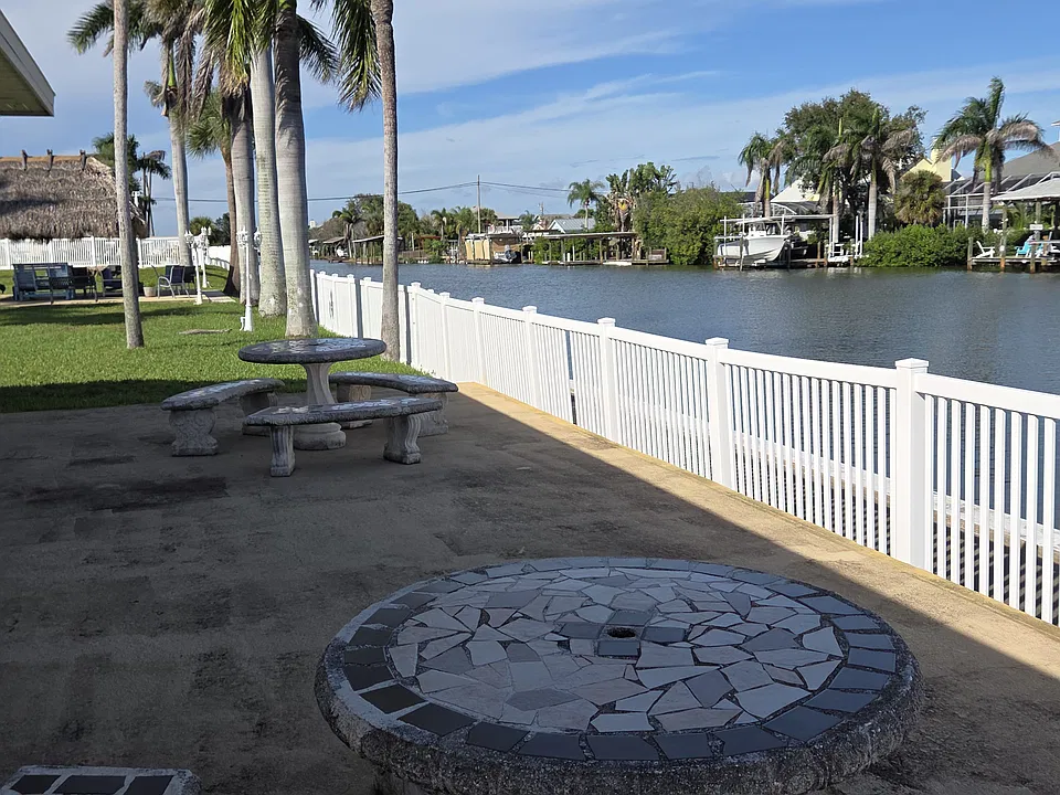 Patio tables, Tiki hut, heated pool, on-site gym, newly redone laundry facility, and beautiful grounds available for use in this beautiful condo property.