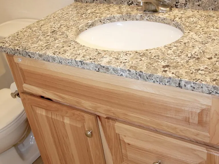 Bathroom updated in 2018, with new hickory vanity, new granite countertop, new satin nickel faucet.