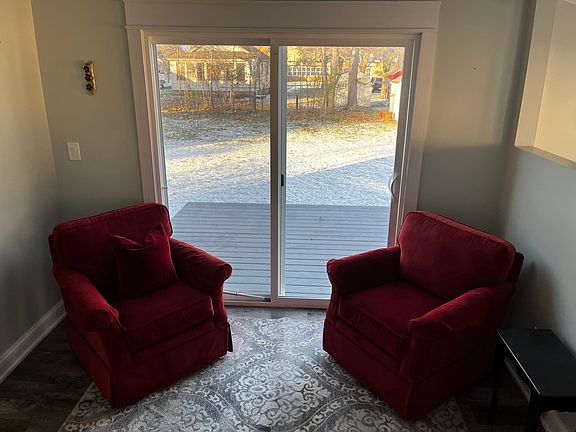 View from a sitting room or office area that leads out to the backyard deck