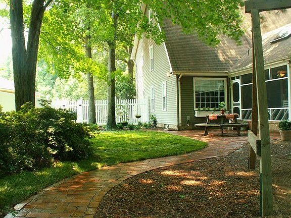 Screened porch and patio overlook park-like back yard!