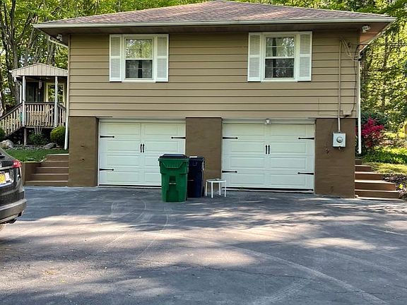 Two car garage with large driveway