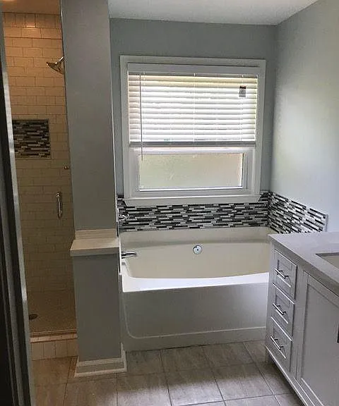 master soaking tub and quartz vanity, new cottage style window