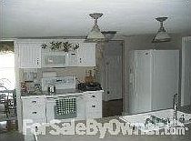 KITCHEN
						:
						Beautiful white cabinetry and large eat-in bar area
