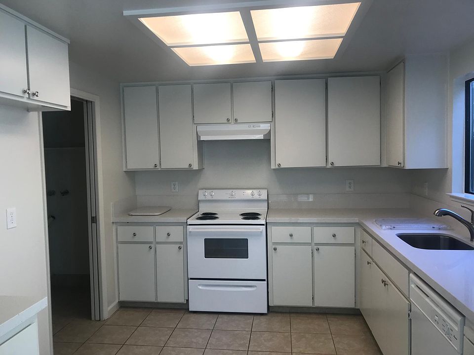Large kitchen with beautiful new counters and tile floor