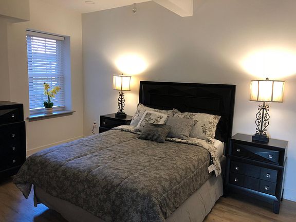 Spacious bedroom with ceiling fans and Large Walk in closet.