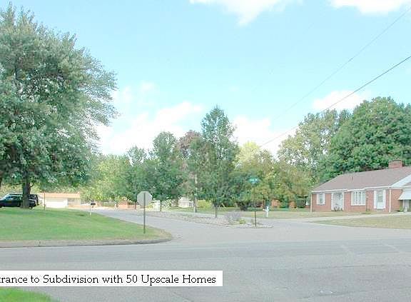 Entrance to subdivision with 75 Upscale Homes