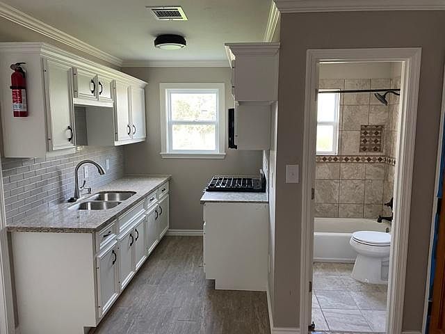 Kitchen will come with ALL stainless steel appliances (stove/oven, fridge/freezer, and microwave).