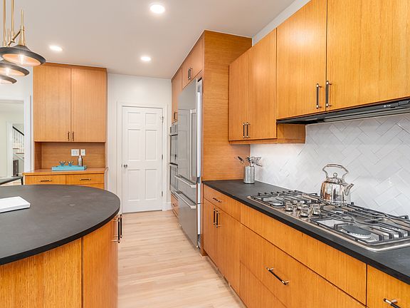 Spacious kitchen with custom cabinetry -- perfect space for entertaining